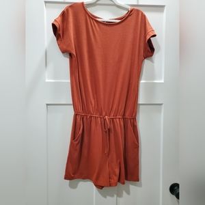 Amazon jumper. Rich burnt orange color, size medium.